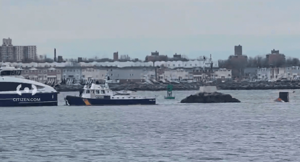 Members of the NYPD Harbor Unit rescue four people who were in the East River after their boat capsized on Sunday afternoon.