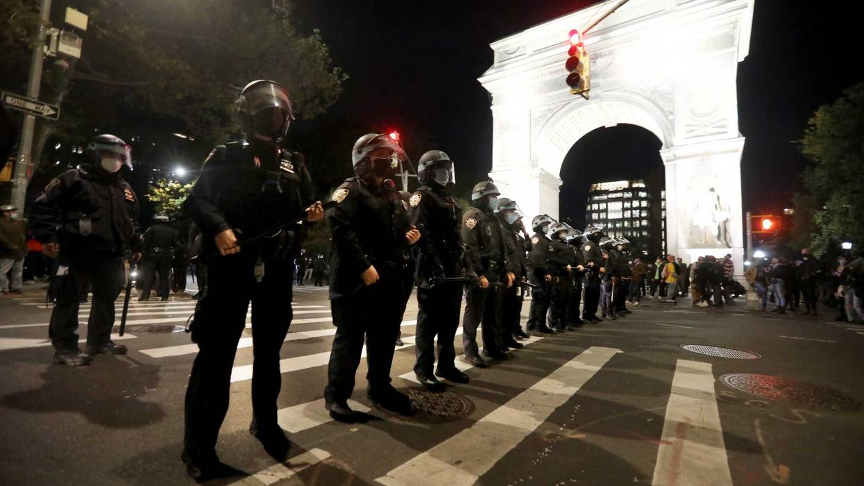 Members of the NYPD stand outside Washington Square Park in Manhattan after police broke up a march in Greenwich Village in Manhattan Nov. 4, 2020