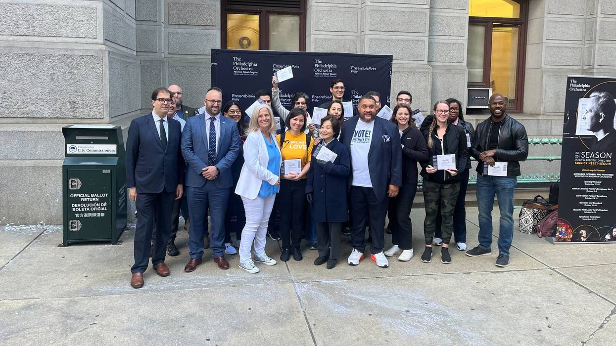 Members of the Philadelphia Orchestra, who will be in China on Election Day, cast their absentee ballots at City Hall on Tuesday.