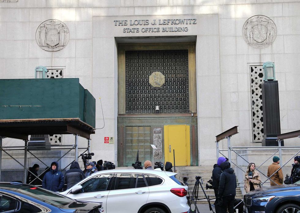 Members of the press are seen in Lower Manhattan on March 20, 2023