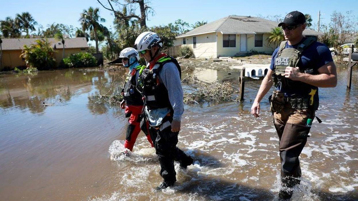 Members of the Texas A&M Task Force 1 Search and Rescue team look for anyone needing help after Hurricane Ian passed through the area on September 30, 2022 in Fort Myers, Florida.