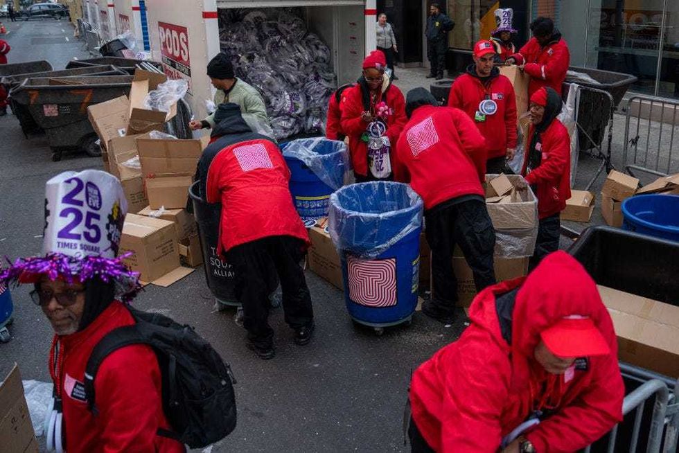 Members of the Times Square Alliance prepare to distribute party favors to revelers on December 31, 2024.
