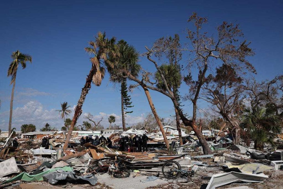 Members of Virginia Task Force 2 Urban Search and Rescue receive a briefing before combing through the wreckage on Fort Myers Beach looking for victims of Hurricane Ian October 04, 2022 in Fort Myers Beach, Florida.