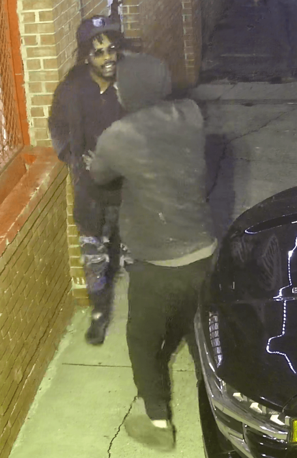 Men arguing on security camera