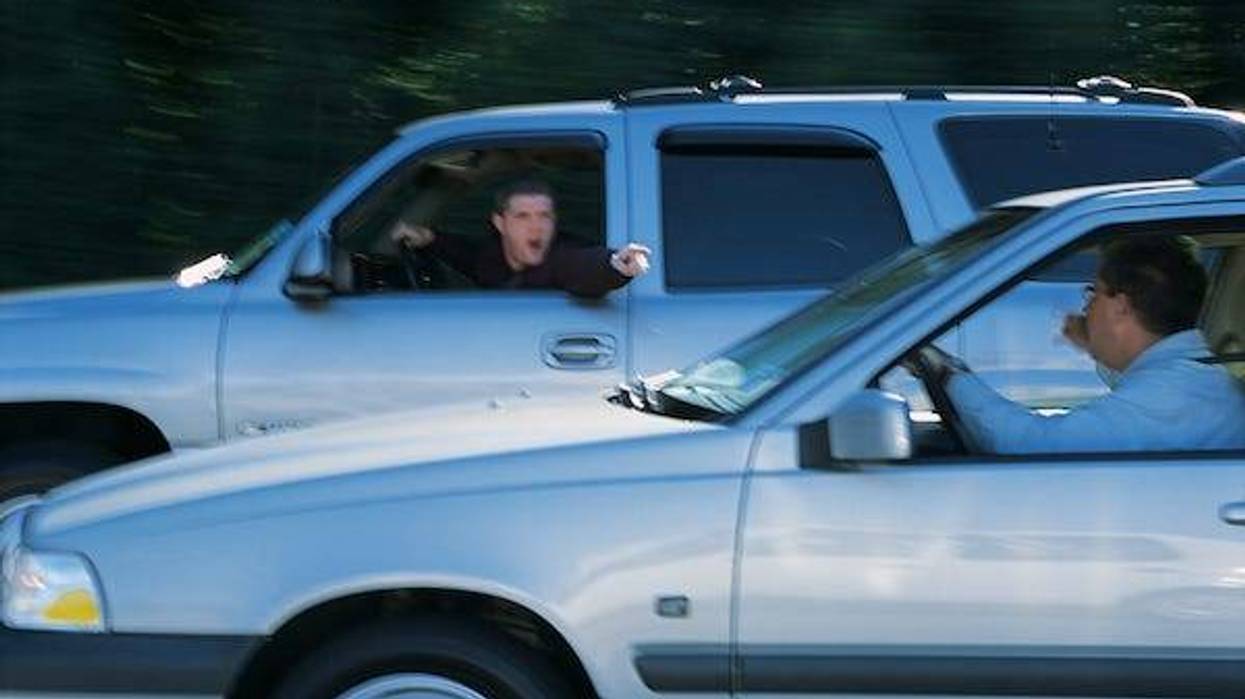 Men arguing with each other from their cars