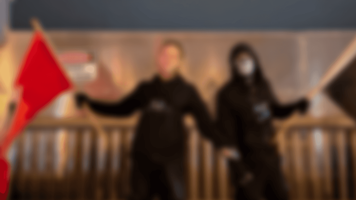 Men holding white nationalist flags