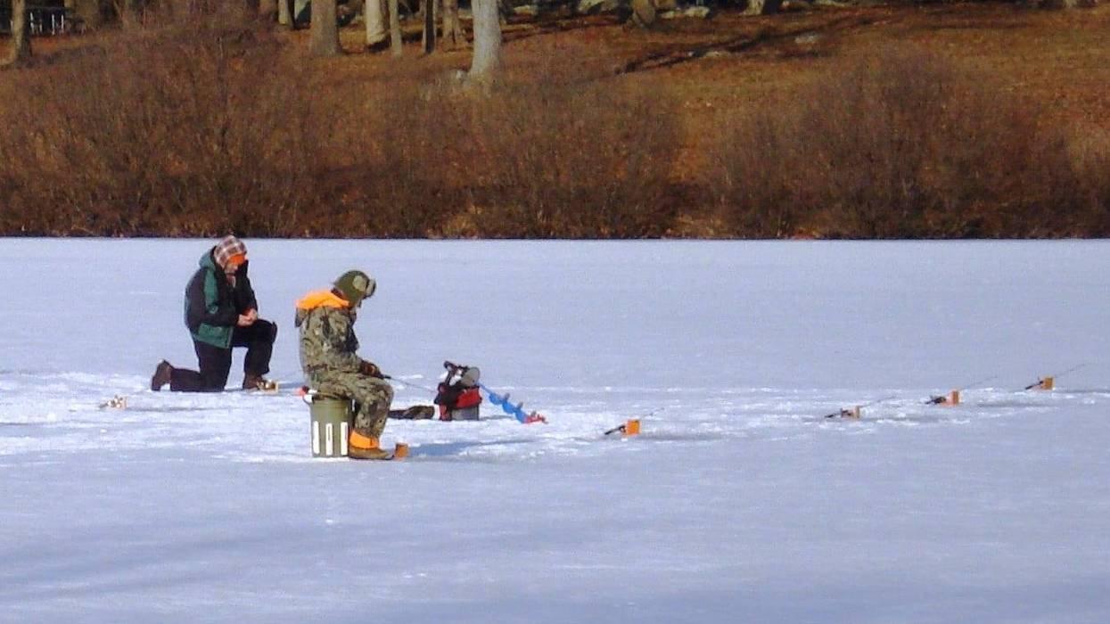 Men ice fish at Montgomery County's Green Lane Reservoir.