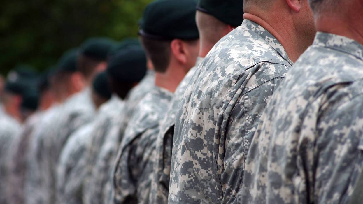 men in military uniforms standing in a line