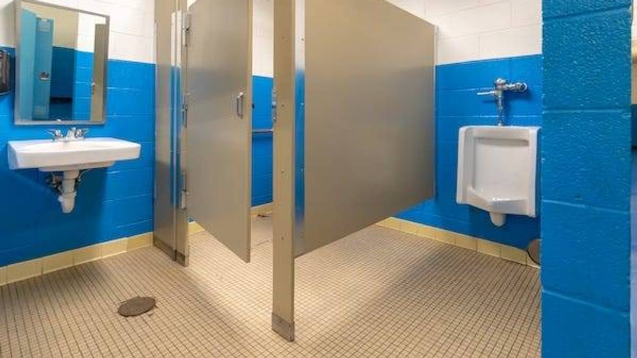 Men's bathroom with a stall and urinal