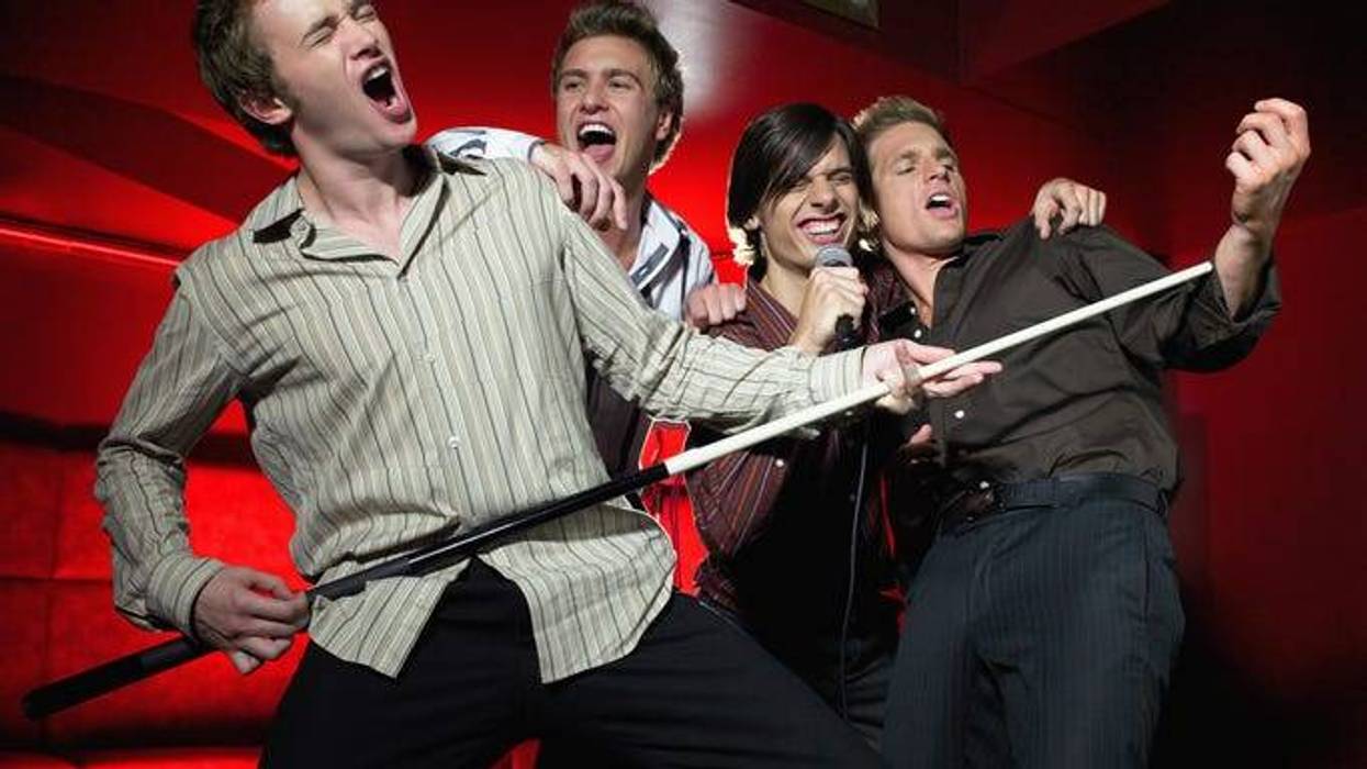 Men Singing In A Bar