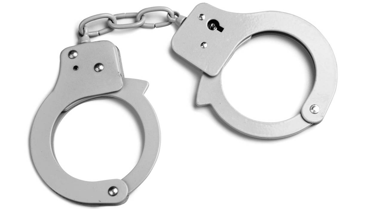 Metallic handcuffs isolated with clipping paths on white background