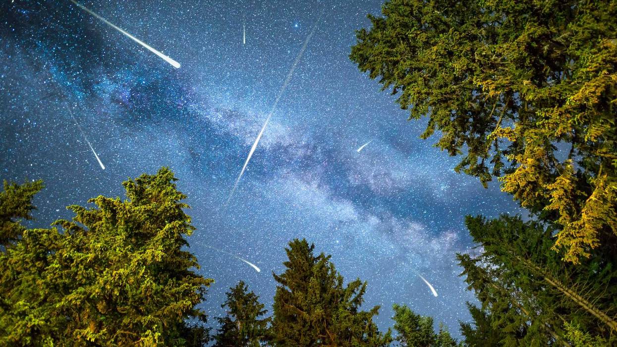 Meteor shower in the night sky.