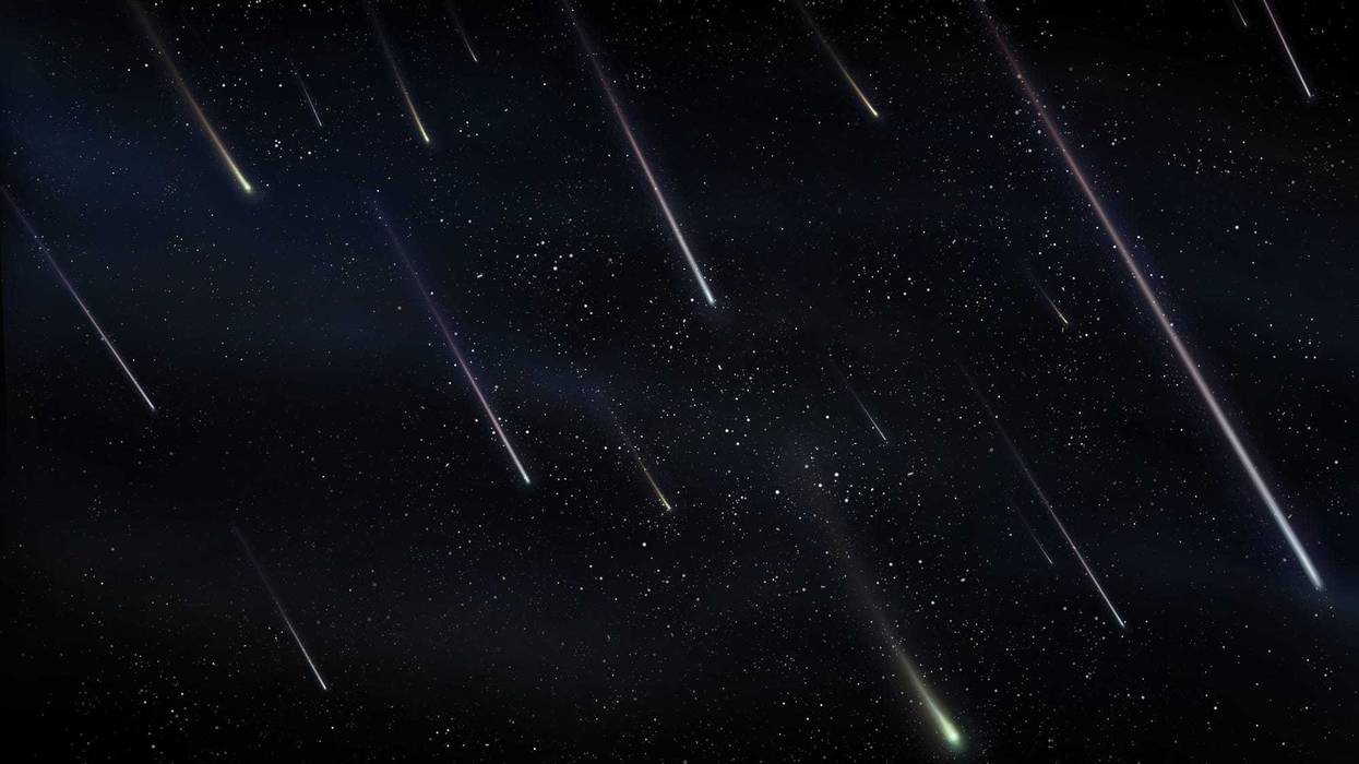 Meteor shower in the night sky.