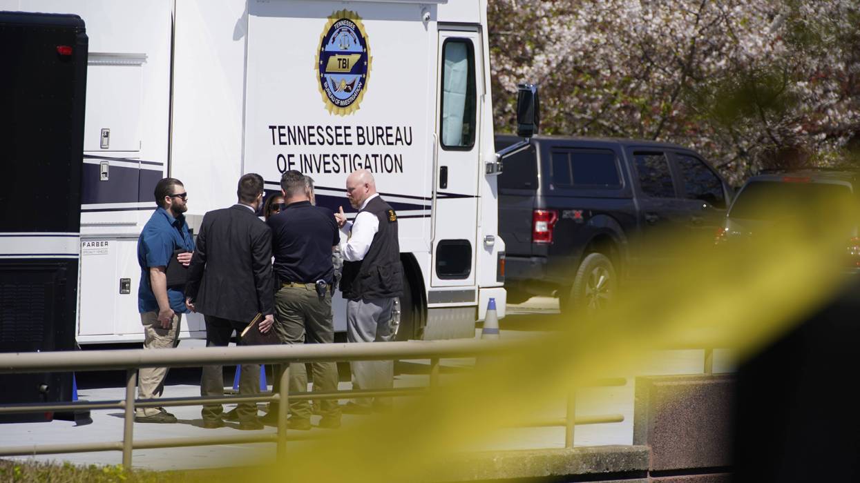 Metro Nashville Police officers gather near Covenant School where three children and three adults were killed by a female shooter Monday, March 27, 2023 in Nashville, Tenn. The perpetrator was killed by police at the scene.