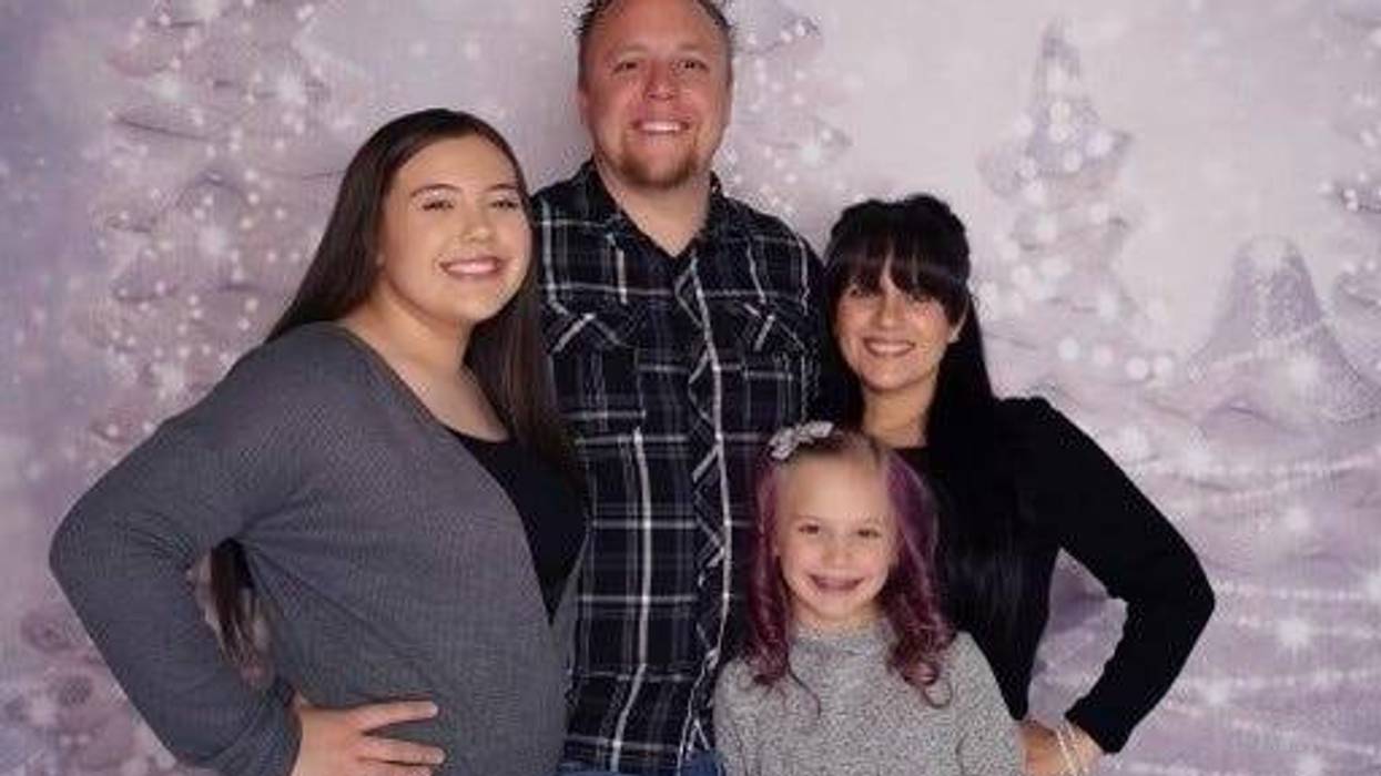 Metro Police officer Douglas King poses for a picture with his family