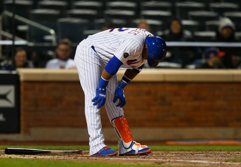 Mets outfielder Yoenis Cespedes reacts to making an out