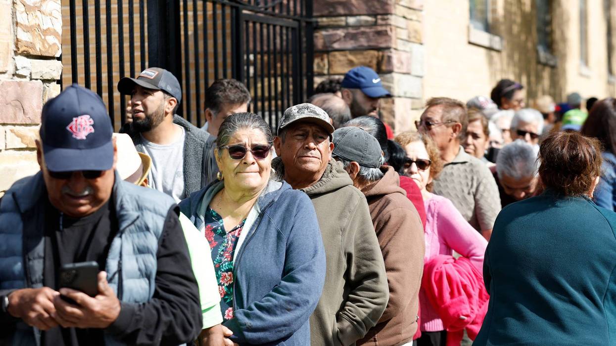 Mexican nationals wait to cast their vote
