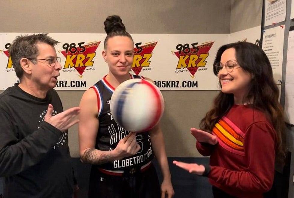 Mia Hopkins spinning a basketball