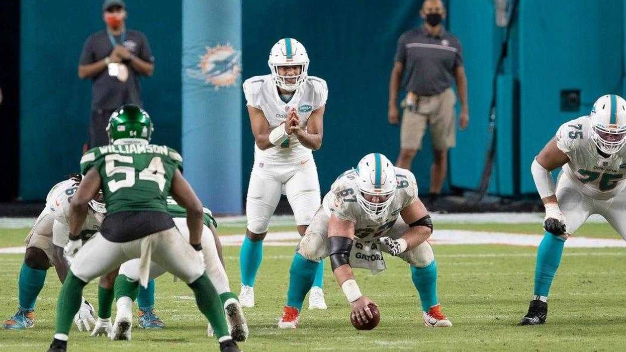 Miami Dolphins quarterback Tua Tagovailoa (1) takes his first snap against the New York Jets at Hard Rock Stadium in Miami Gardens.
