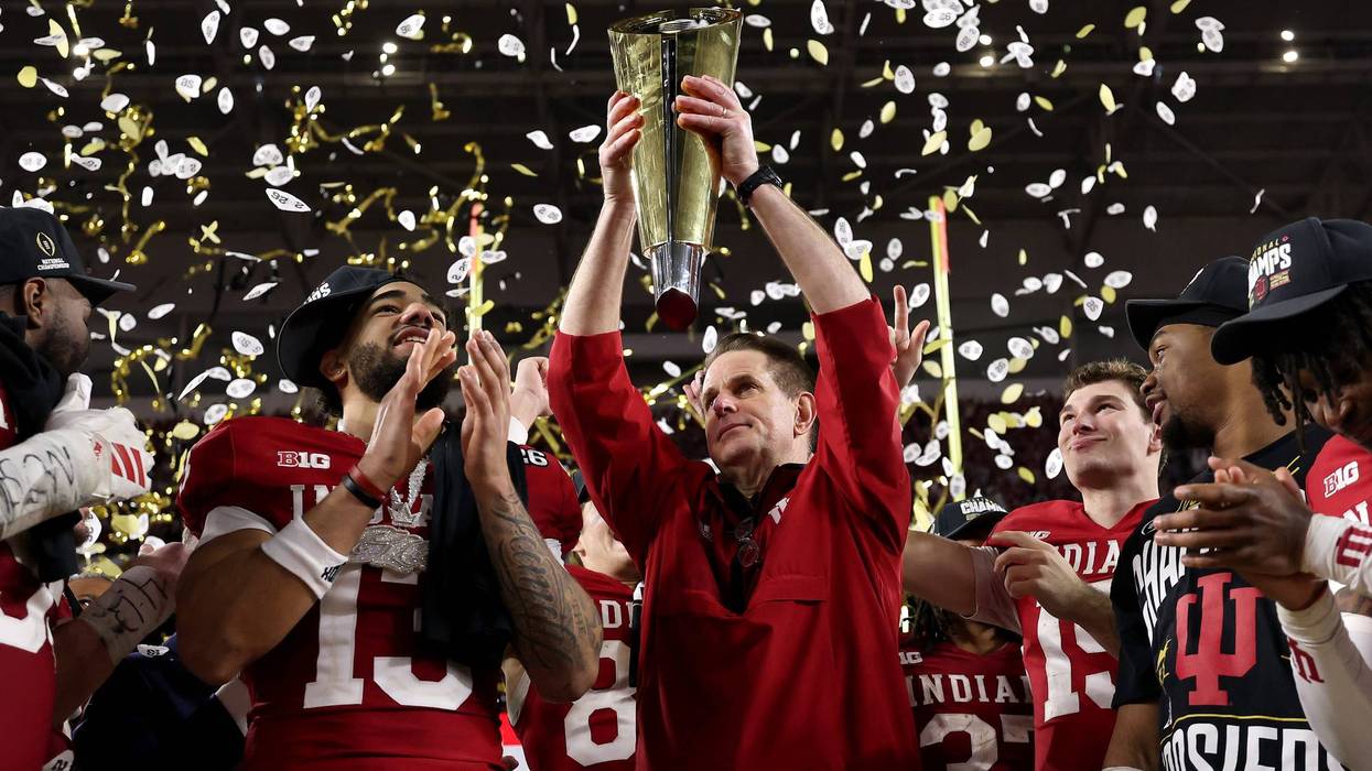 MIAMI GARDENS, FLORIDA - JANUARY 19: Head coach Curt Cignetti of the Indiana Hoosiers hoists the College Football Playoff National Championship Trophy after defeating the Miami Hurricanes 27-21 in the 2026 College Football Playoff National Championship at Hard Rock Stadium on January 19, 2026 in Miami Gardens, Florida.