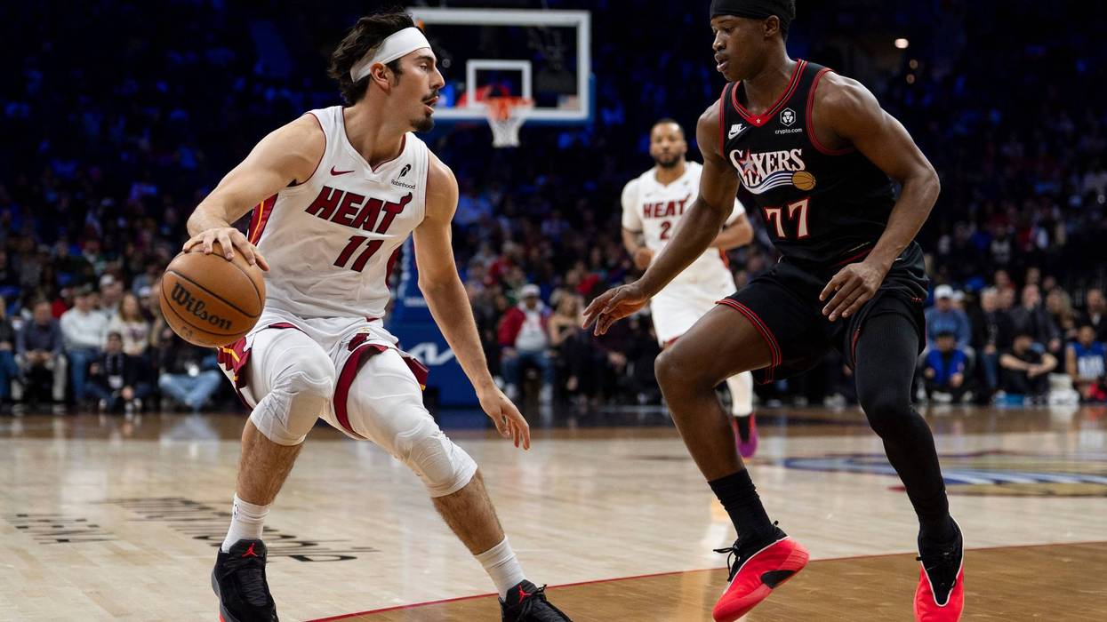 Miami Heat's Jaime Jaquez Jr., left, looks to make his move against Philadelphia 76ers' VJ Edgecombe, right, during the first half of an NBA basketball game, Thursday, Feb. 26, 2026, in Philadelphia.