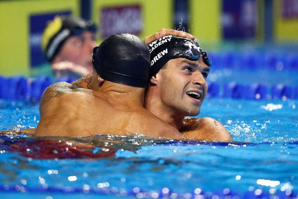 Michael Andrew getting a hug from fellow Olympic athlete Calaeb Dressel June 20 during the Olympic swimming trials.