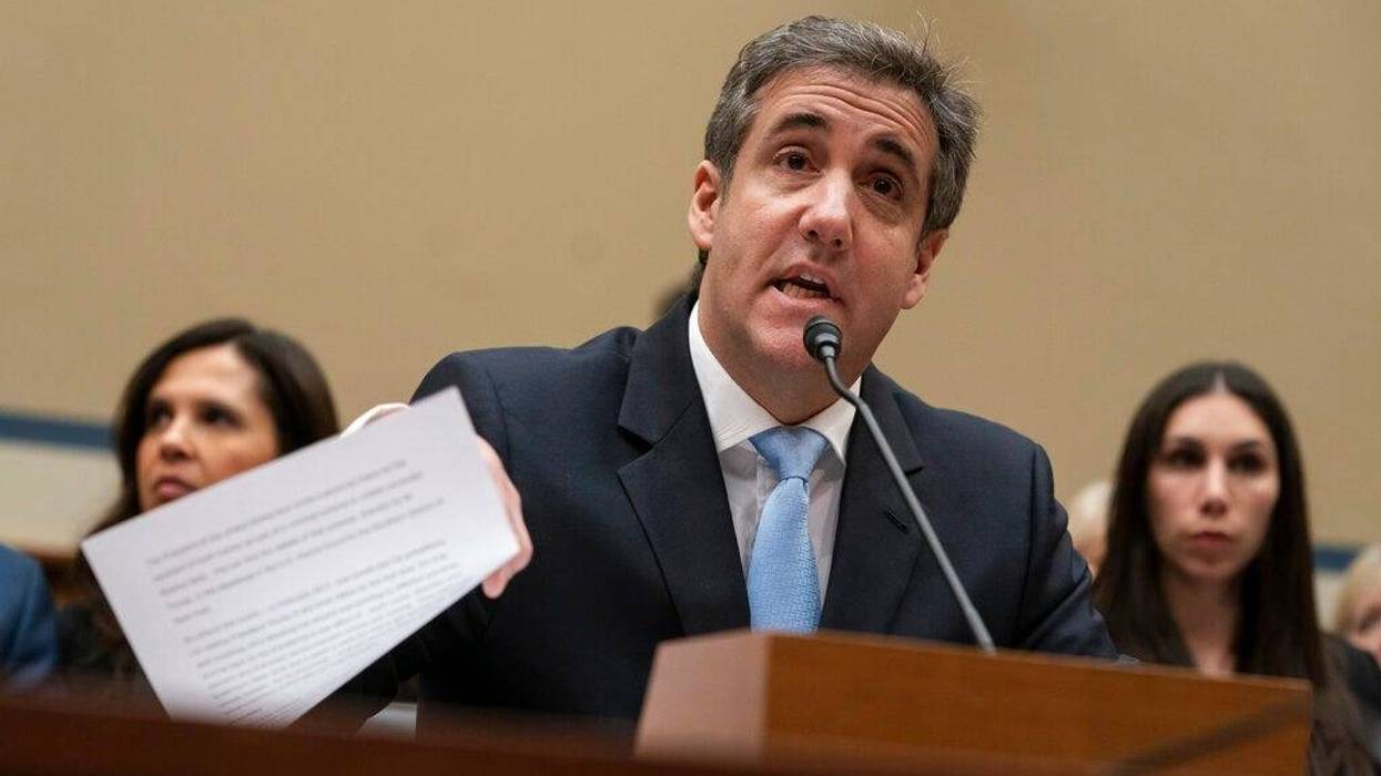 Michael Cohen, President Donald Trump's former personal lawyer, reads an opening statement as he testifies before the House Oversight and Reform Committee on Capitol Hill in Washington.
