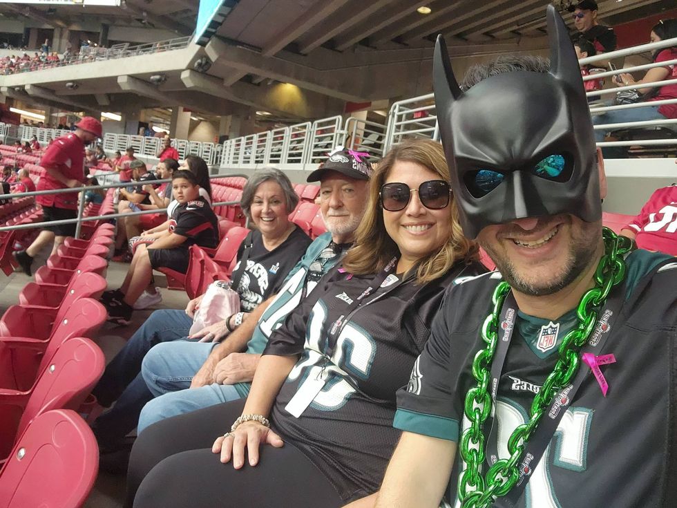 Michael Gordon (right) at an Eagles game, with (right to left) his wife Lauren and parents Henry and Gayle Winkler.