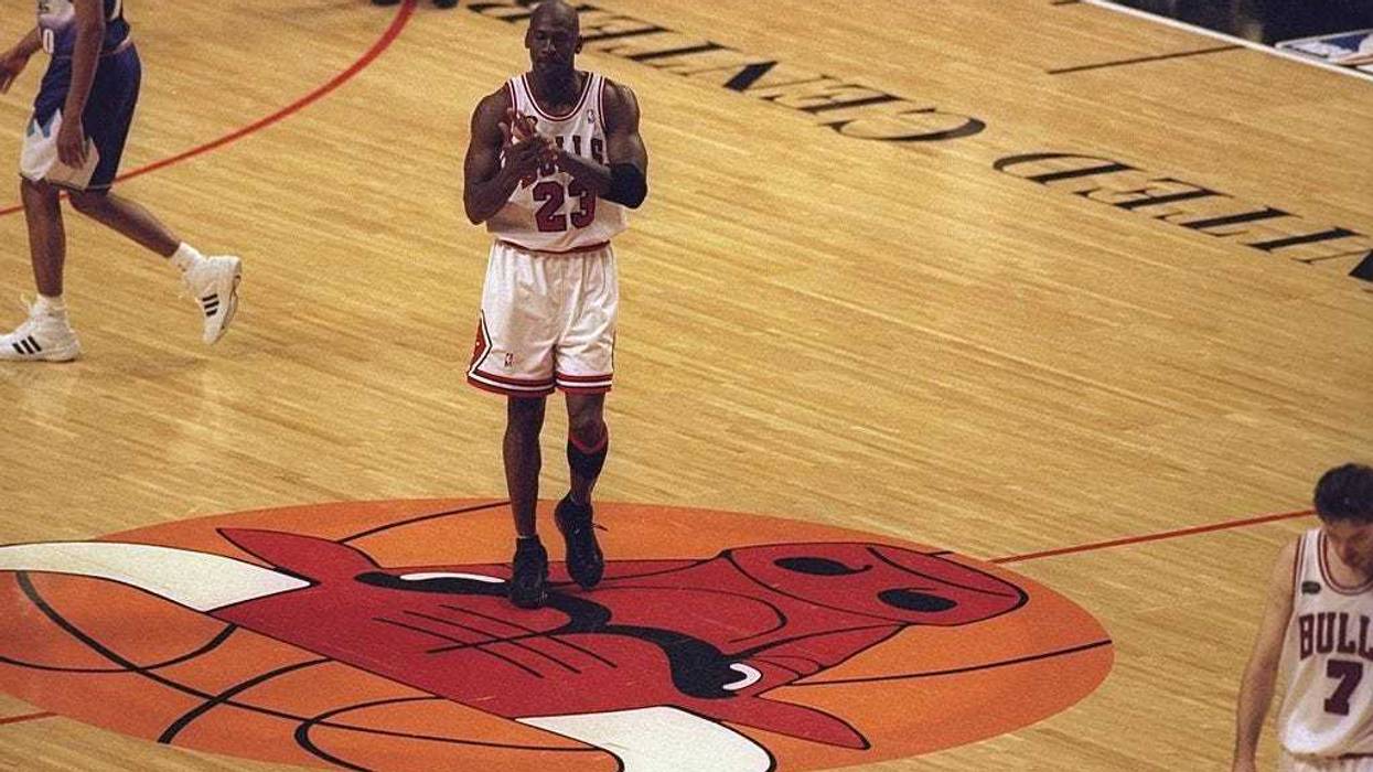 Michael Jordan #23 of the Chicago Bulls walking to the bench duing a time out called during the NBA Finals game 3 against the Utah Jazz at the United Center in Chicago, Illinois. The Bulls defeated the Jazz 96-54.