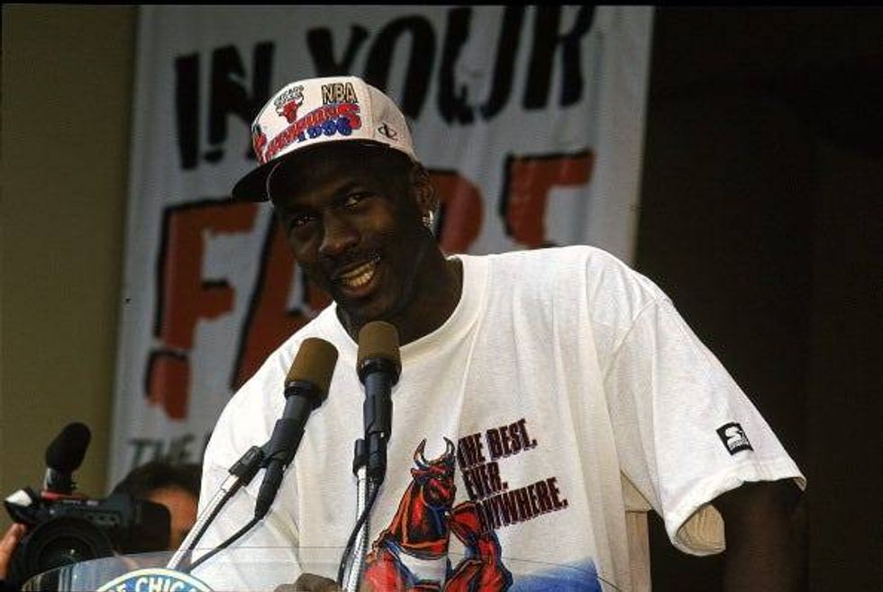 Michael Jordan talks to Bulls fans at the 1996 championship parade.