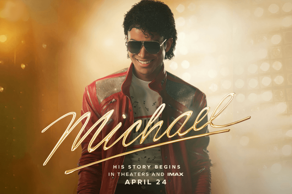 Michael movie poster: Smiling Michael Jackson in red jacket and sunglasses.