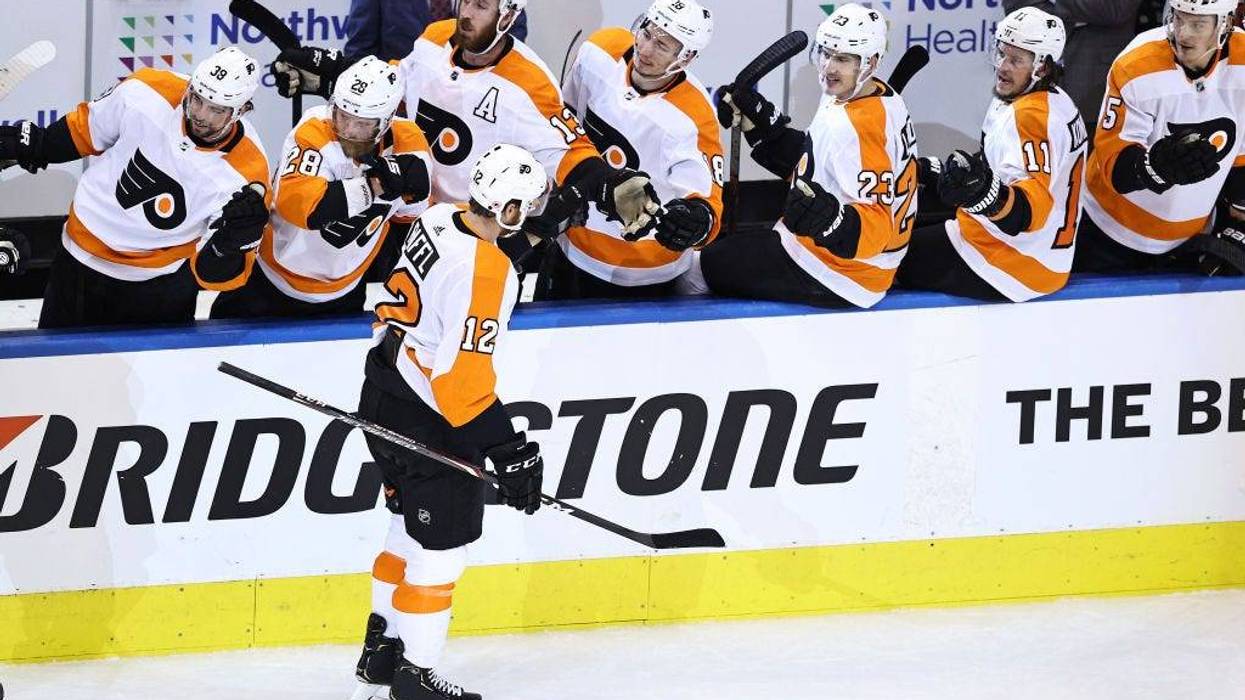 Michael Raffl #12 of the Philadelphia Flyers is congratulated by his teammates after scoring a goal