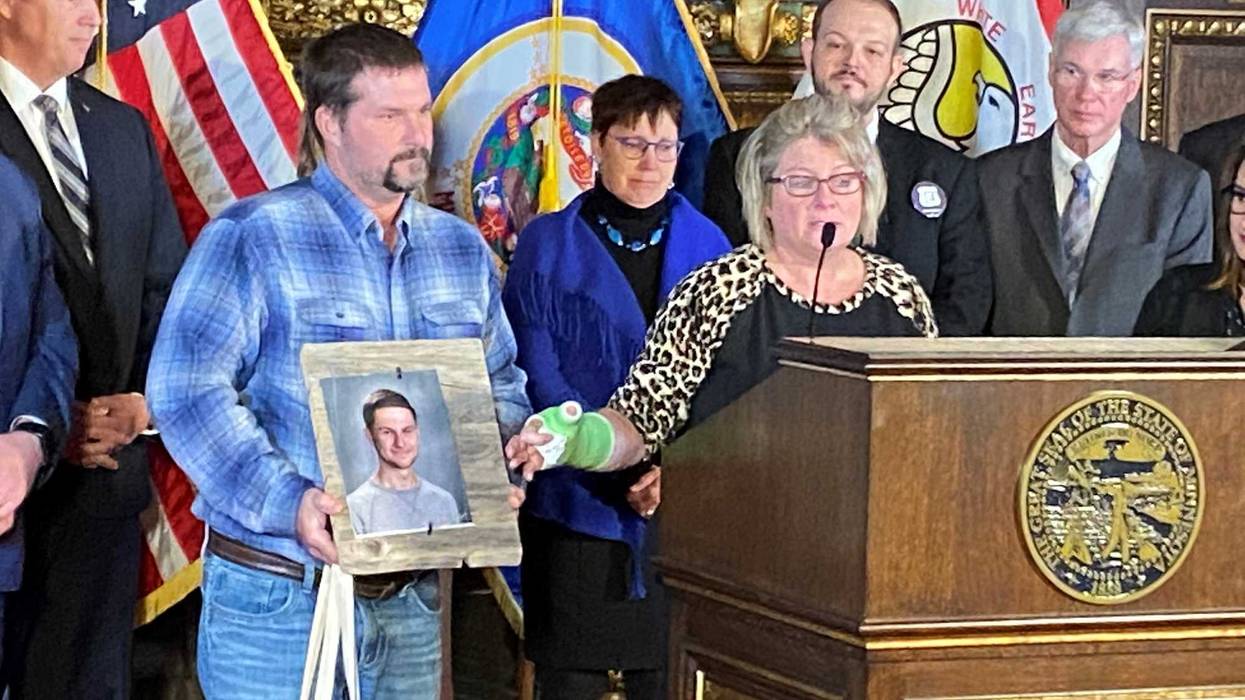 Michele Gran points to a picture of her son, Landon