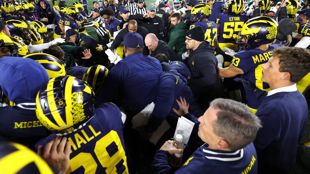Michigan and Michigan State players clash after game