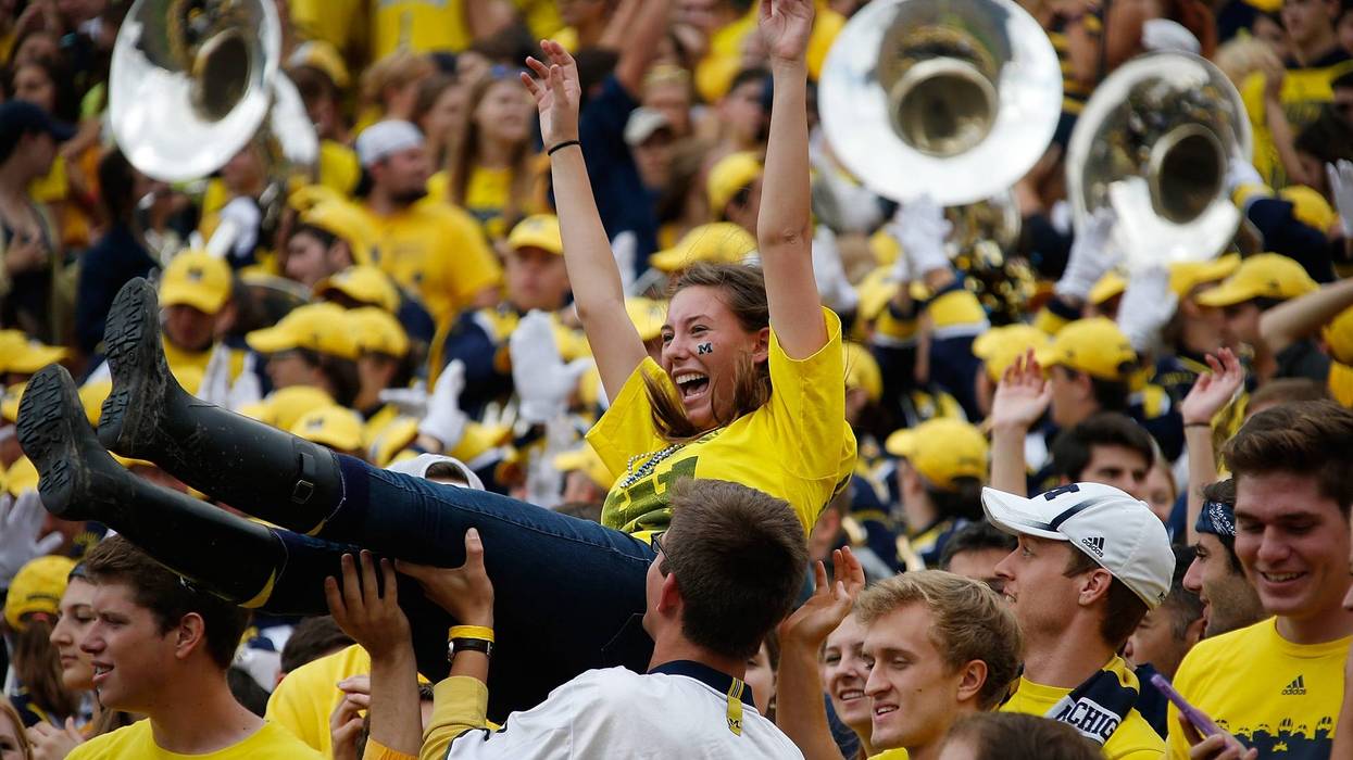 Michigan football fans celebrating