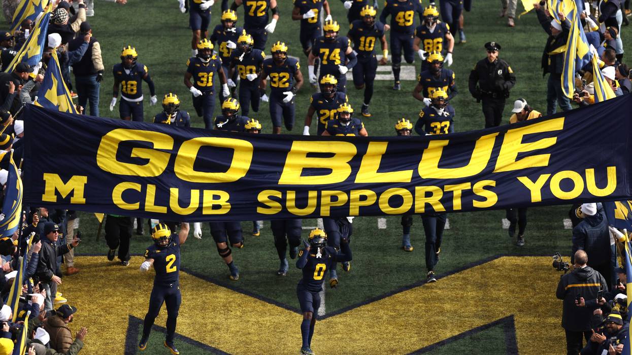 Michigan football team runs onto the field