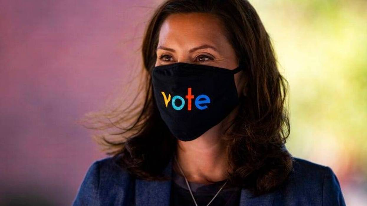 Michigan Gov. Gretchen Whitmer wears a mask with the word "vote" displayed on the front during a roundtable discussion on healthcare, Wednesday Oct. 7, 2020, in Kalamazoo, Mich. P