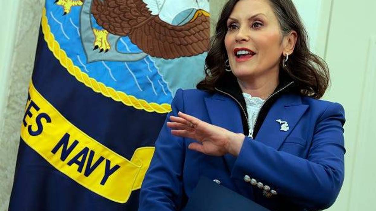Michigan Governor Whitmer stands in the Oval Office during a visit to the White House