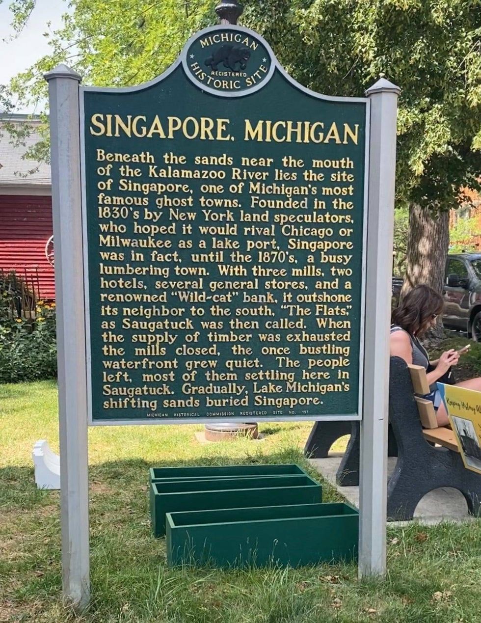 Michigan Historic Site marker outside Saugatuck City Hall tells the story of Singapore.