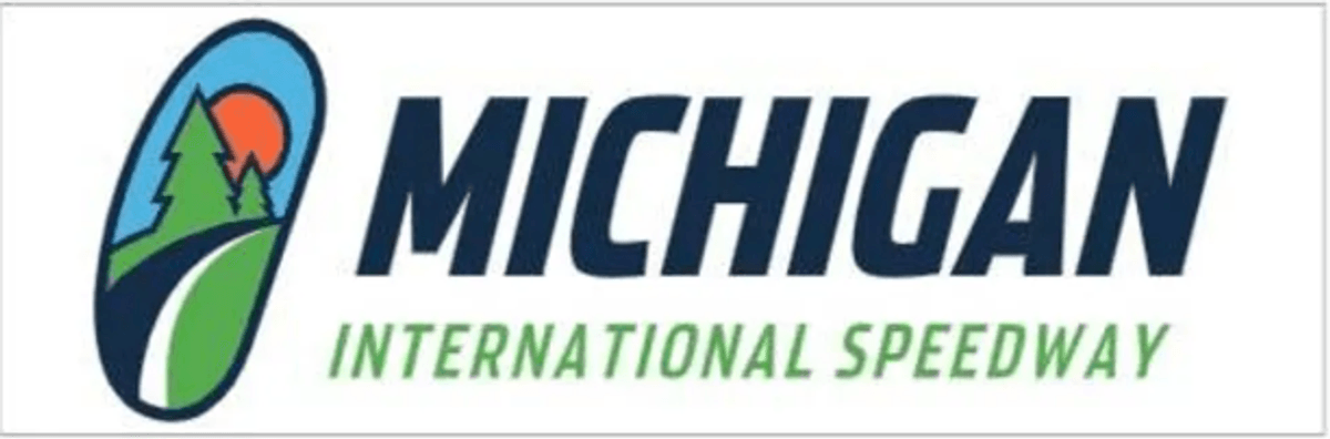 Michigan International Speedway logo featuring trees, sun, and road in an oval design.