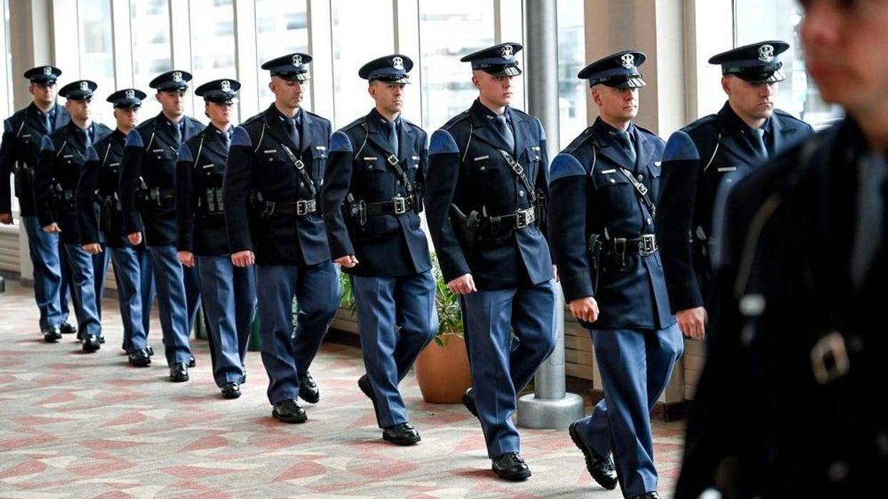 Michigan State Police recruits walk into their graduation ceremony at the Lansing Center on Friday, May 27, 2022, in downtown Lansing. The graduates of MSP's 141st Trooper Recruit School are the first ever candidates to join the force already serving as law enforcement officers.