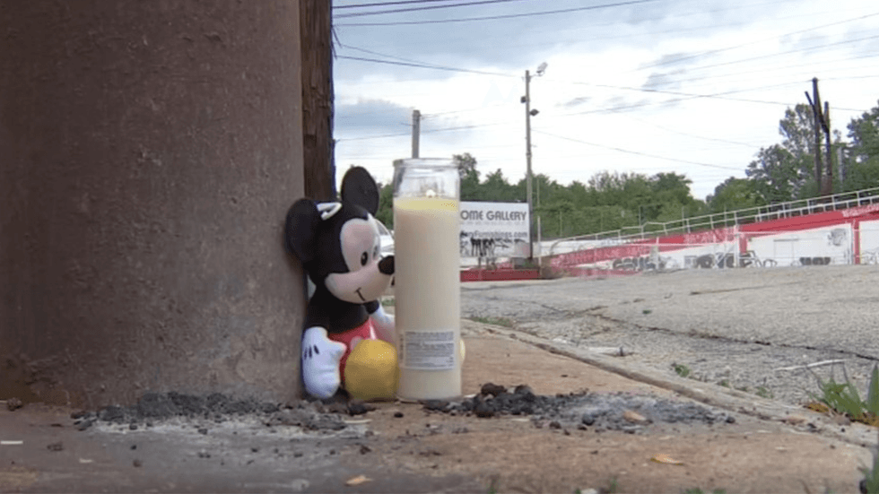 Mickey Mouse and a candle on the sidewalk near where Dorothea was struck and killed