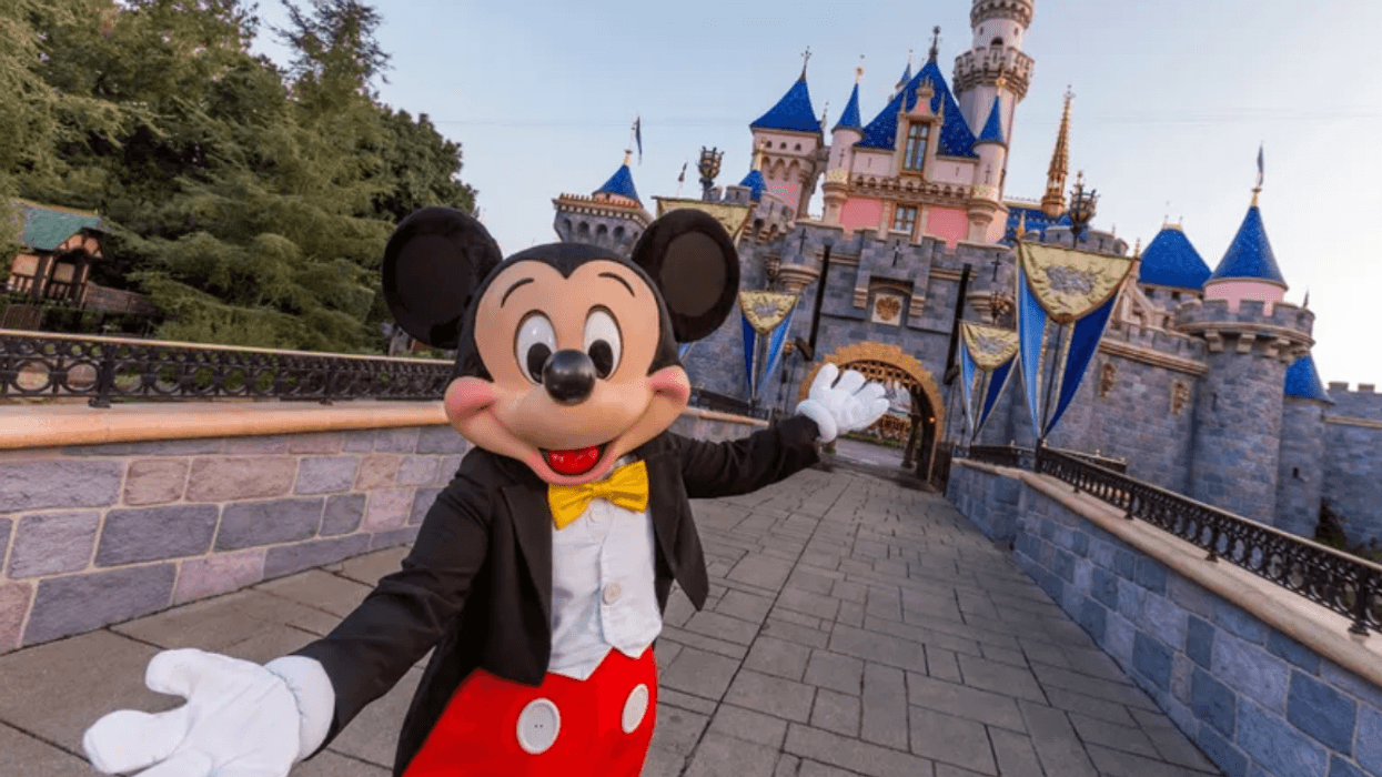 Mickey Mouse poses in front of Sleeping Beauty Castle at Disneyland Park on August 27, 2019 in Anaheim, California. Disneyland plans to reopen on April 30, 2021.