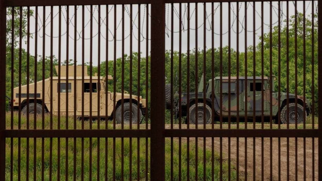 Migrant Crossings At Southern Border Increase Ahead Of Title 42 Expiration BROWNSVILLE, TX - MAY 04: Military-style humvees are parked along the border wall near Texas Southmost College on May 4, 2023 in Brownsville, Texas. Two days ago President Biden announced that 1,500 active-duty troops would be sent to the U.S.-Mexico border as Title 42 is expected to expire next week. (Photo by Michael Gonzalez/Getty Images)