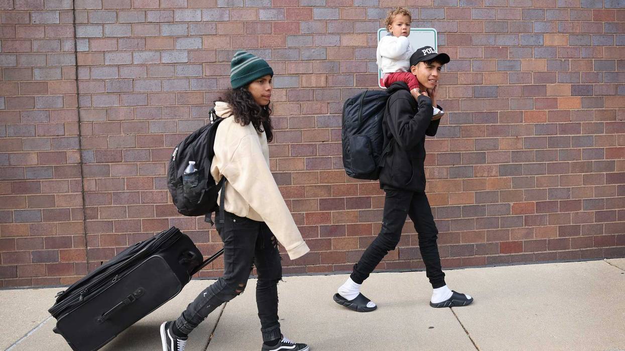 migrant family on sidewalk