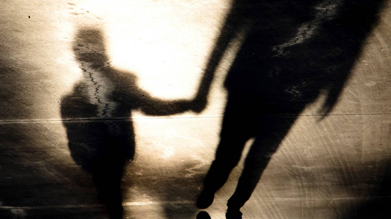 migrant illustration of parent and child holding hands