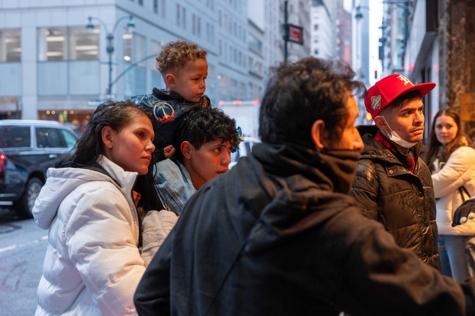 Migrants and their families check into a processing center at the Roosevelt Hotel in Midtown Manhattan as thousands of migrants continue to arrive into the city weekly on Jan. 9, 2024