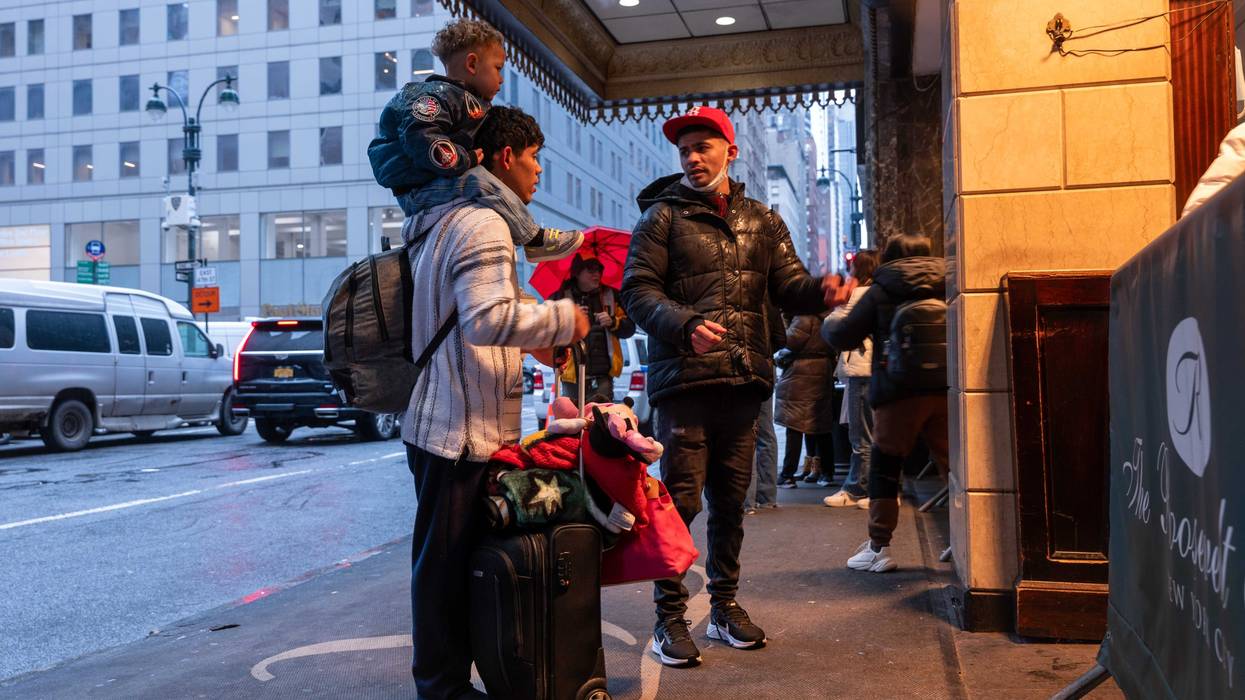Migrants and their families check into a processing center at the Roosevelt Hotel in Midtown Manhattan last year
