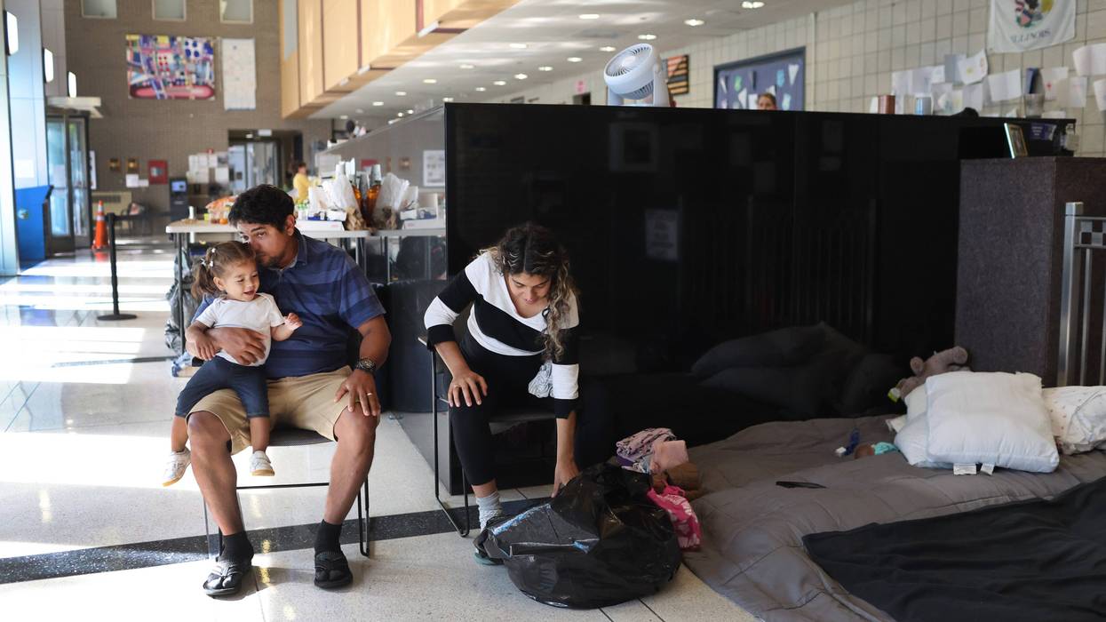 migrants at police station lobby