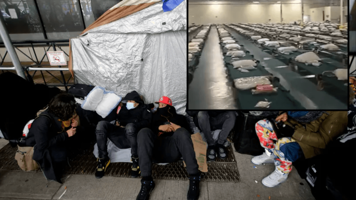 Migrants camp out in front of the Watson Hotel after being evicted on January 30, 2023 in New York City. Migrants who have been staying at the Watson Hotel since arriving to NYC were evicted over the weekend to be relocated to the recently opened up migrant relief center for single adult men at the Brooklyn Cruise Terminal. The ones who refused have been camping out in front of the hotel since eviction. Several migrants who agreed to the relocation returned, complaining of lack of heat and bathroom space.